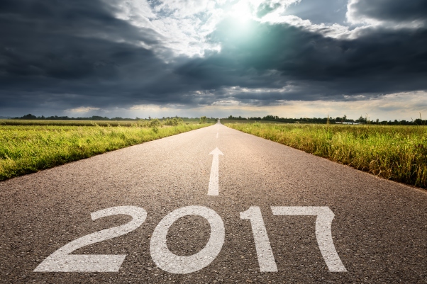 Empty road to upcoming 2017 against the big cloud